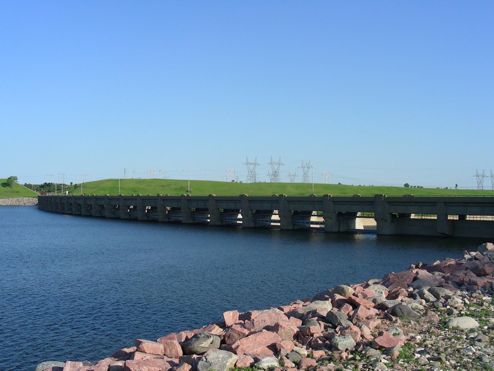 Lake side view of open Garrison dam spill way gates due to record flooding of 2011