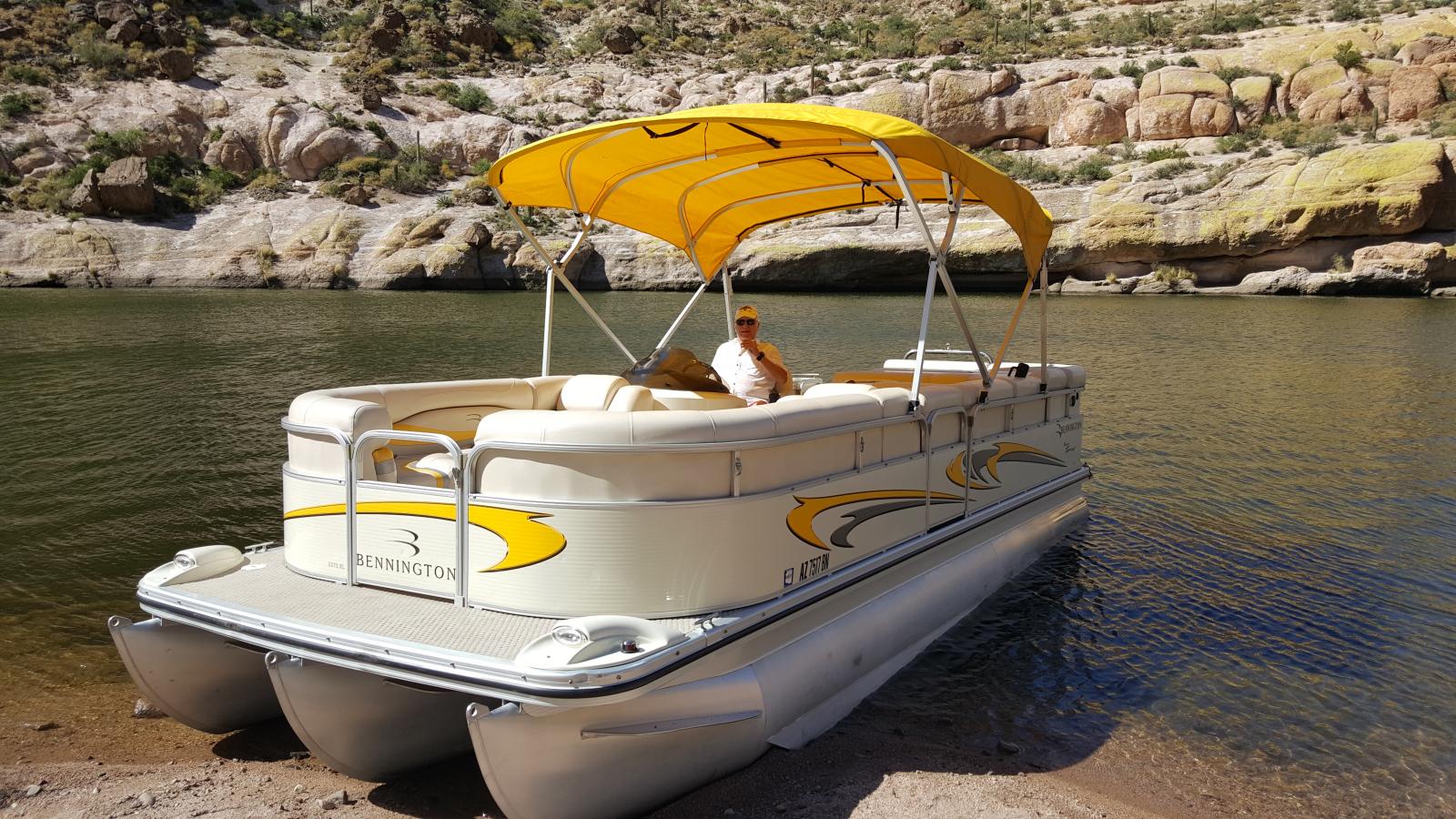 Me on Canyon Lake in Arizona.  Pontoons hold up better on the rocks than a fiberglass hull!