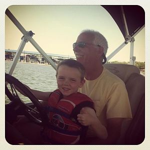 Grandson at the helm